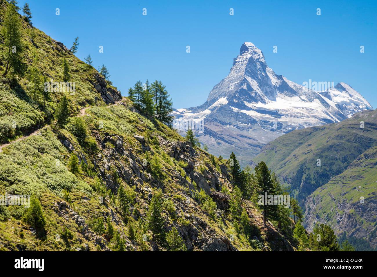 The Matterhorn peak over the Mattertal valley in Walliser aslps. Stock Photo