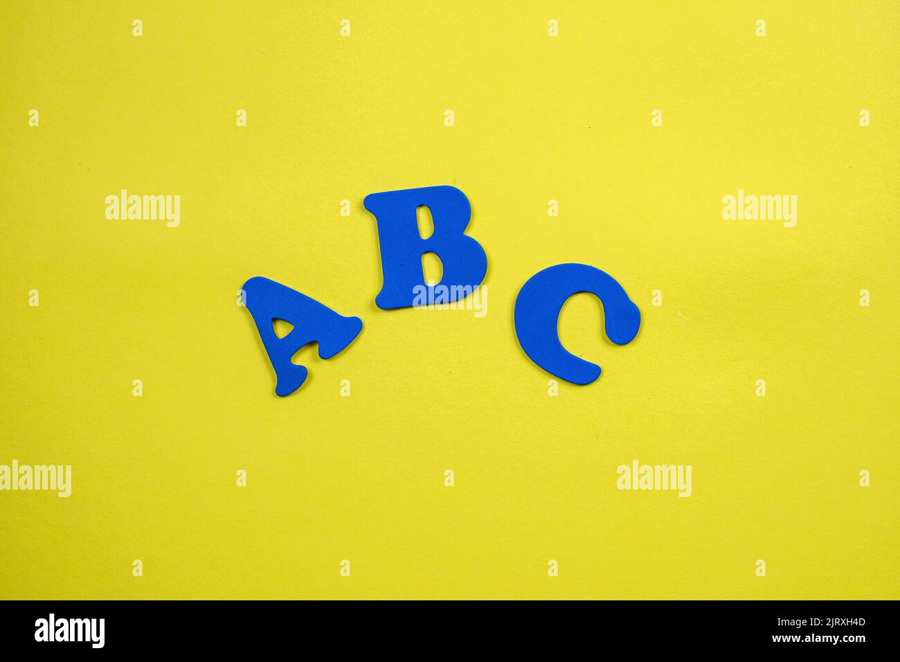 Back to school supplies and letters on yellow background. Beginning of the school year Stock Photo