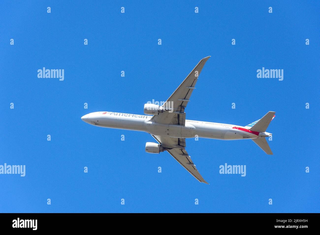 American Airlines Boeing 777-300ER aircraft taking off from Heathrow Airport, Greater London, England, United Kingdom Stock Photo