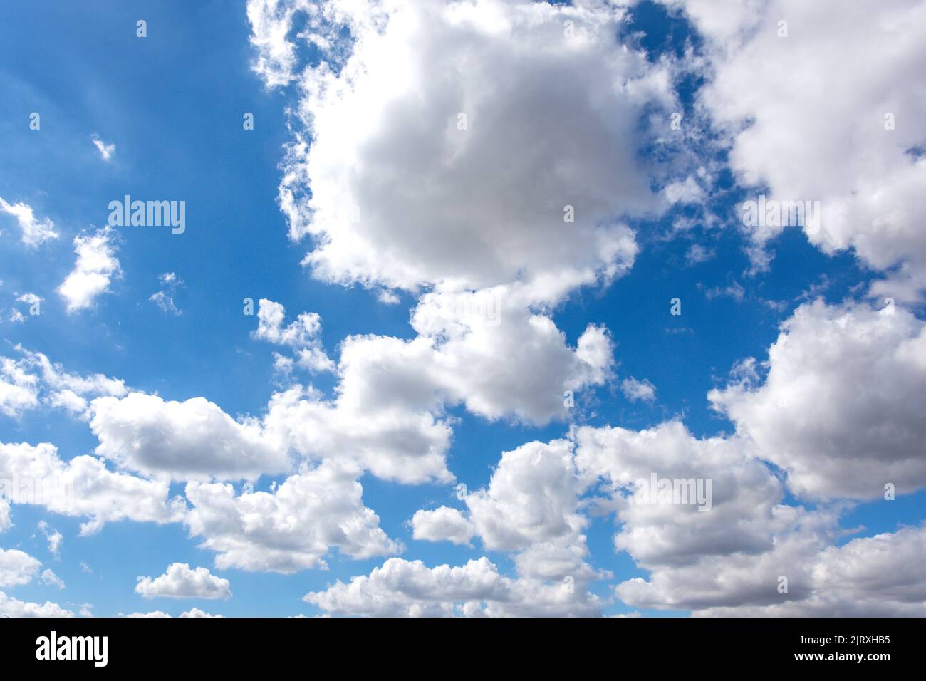 White cumulus clouds against blue sky, Seaburn, Sunderland, Tyne and Wear, England, United Kingdom Stock Photo