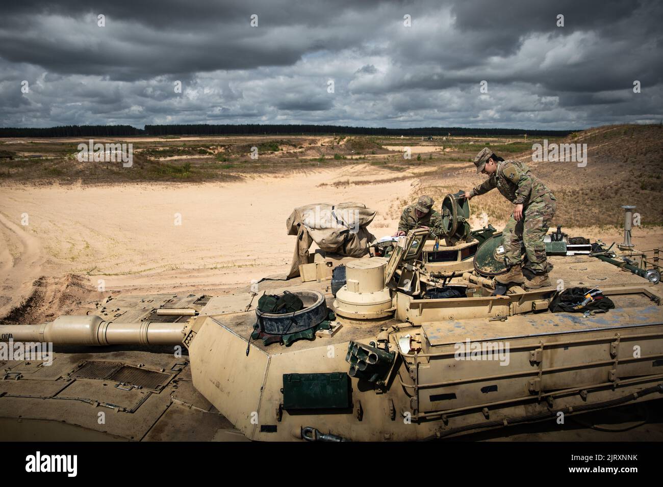 U.S. Army 2nd Lt. Emily Alvarado, a tank commander assigned to the 1st Battalion, 66th Armor Regiment, 3rd Armored Brigade Combat Team, 4th Infantry Division, conducts an equipment inspection on an M1A2 Abrams tank at Pabrade, Lithuania, July 19, 2022. (U.S. Army National Guard photo by Sgt. Agustín Montañez) Stock Photo