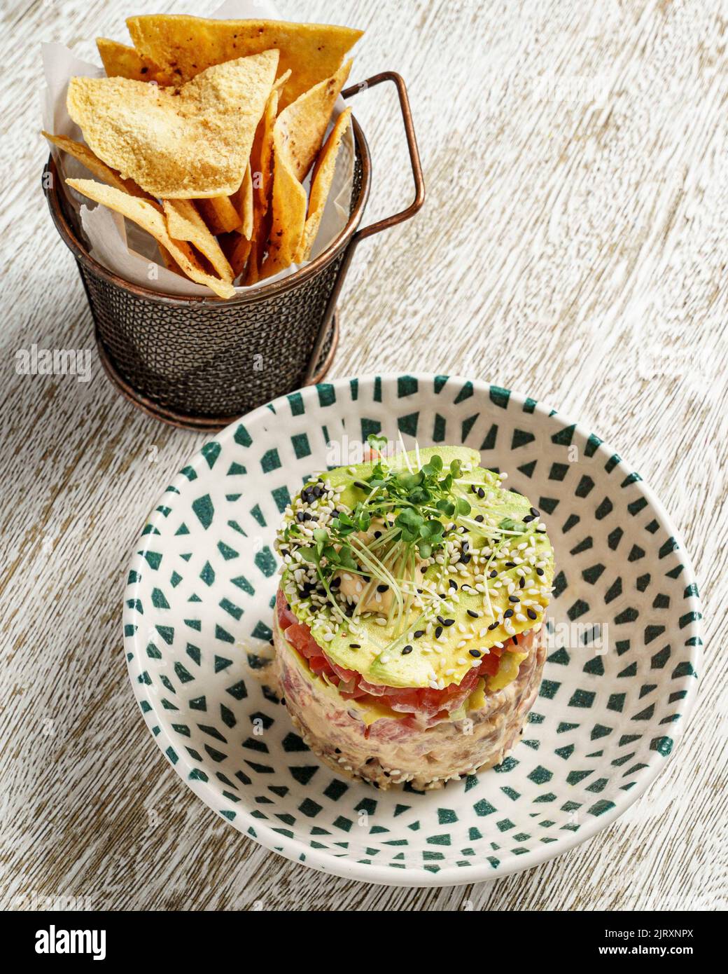 A tuna tartare with the pita chips on the table Stock Photo Alamy