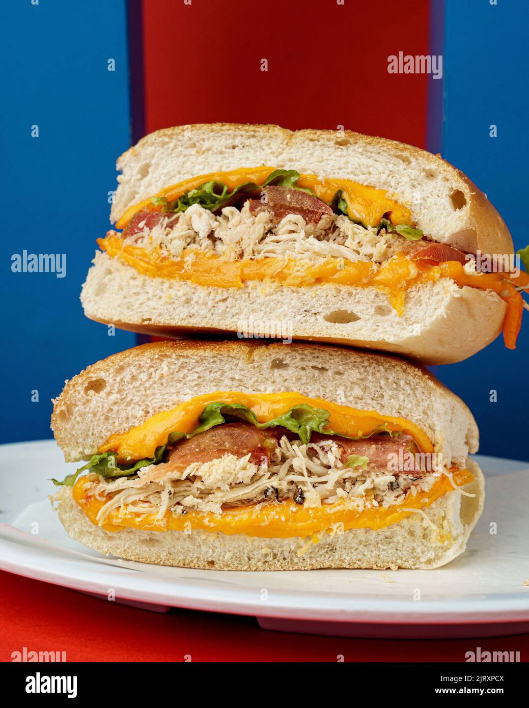 A chicken sandwich cut in two halves Stock Photo