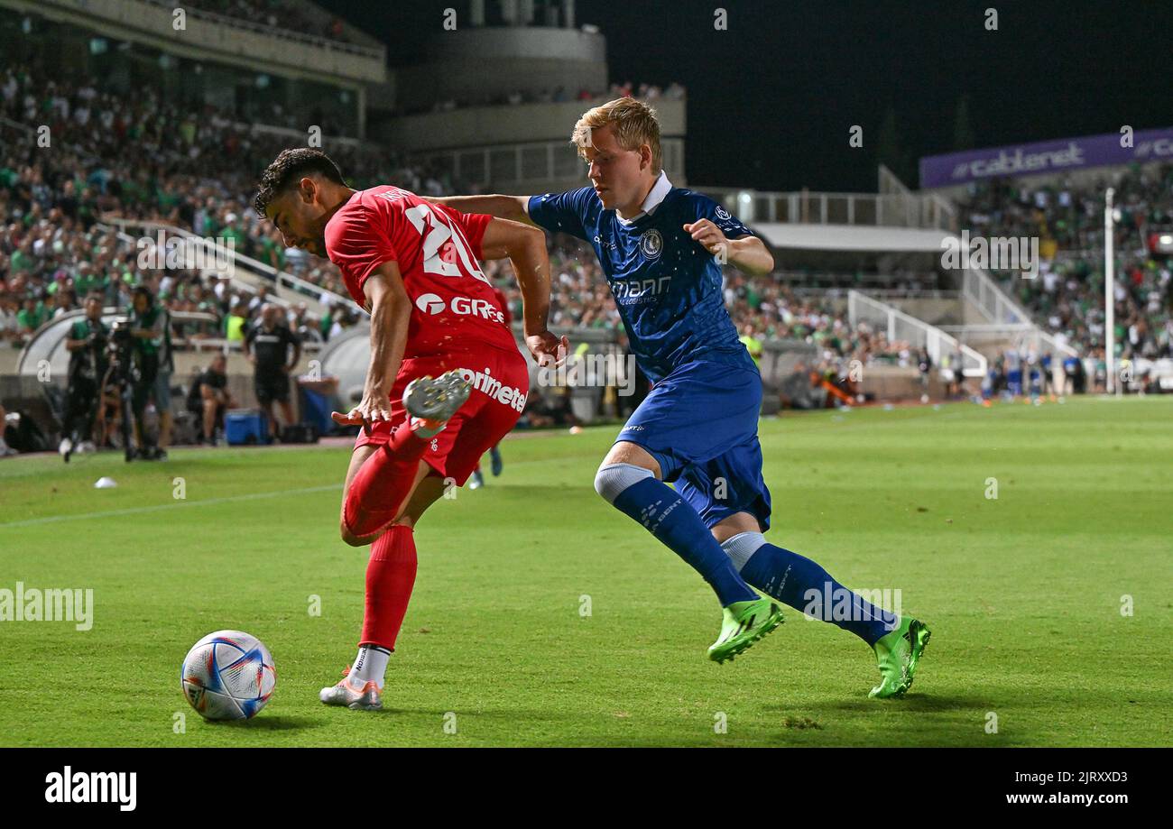 Omonia's Panagiotis Zachariou and Gent's Jens Petter pictured in action during a soccer game between Cypriot Omonia Nicosia and Belgian KAA Gent in Nicosia, Cyprus on Thursday 25 August 2022, the return leg of the play-offs for the UEFA Europa League competition. BELGA PHOTO DAVID CATRY Stock Photo