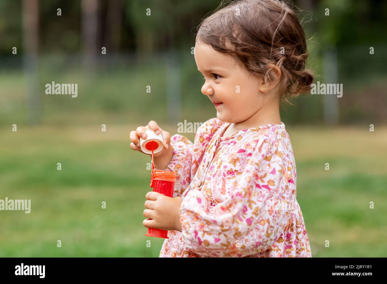 happy baby girl with soap bubble blower in summer Stock Photo - Alamy