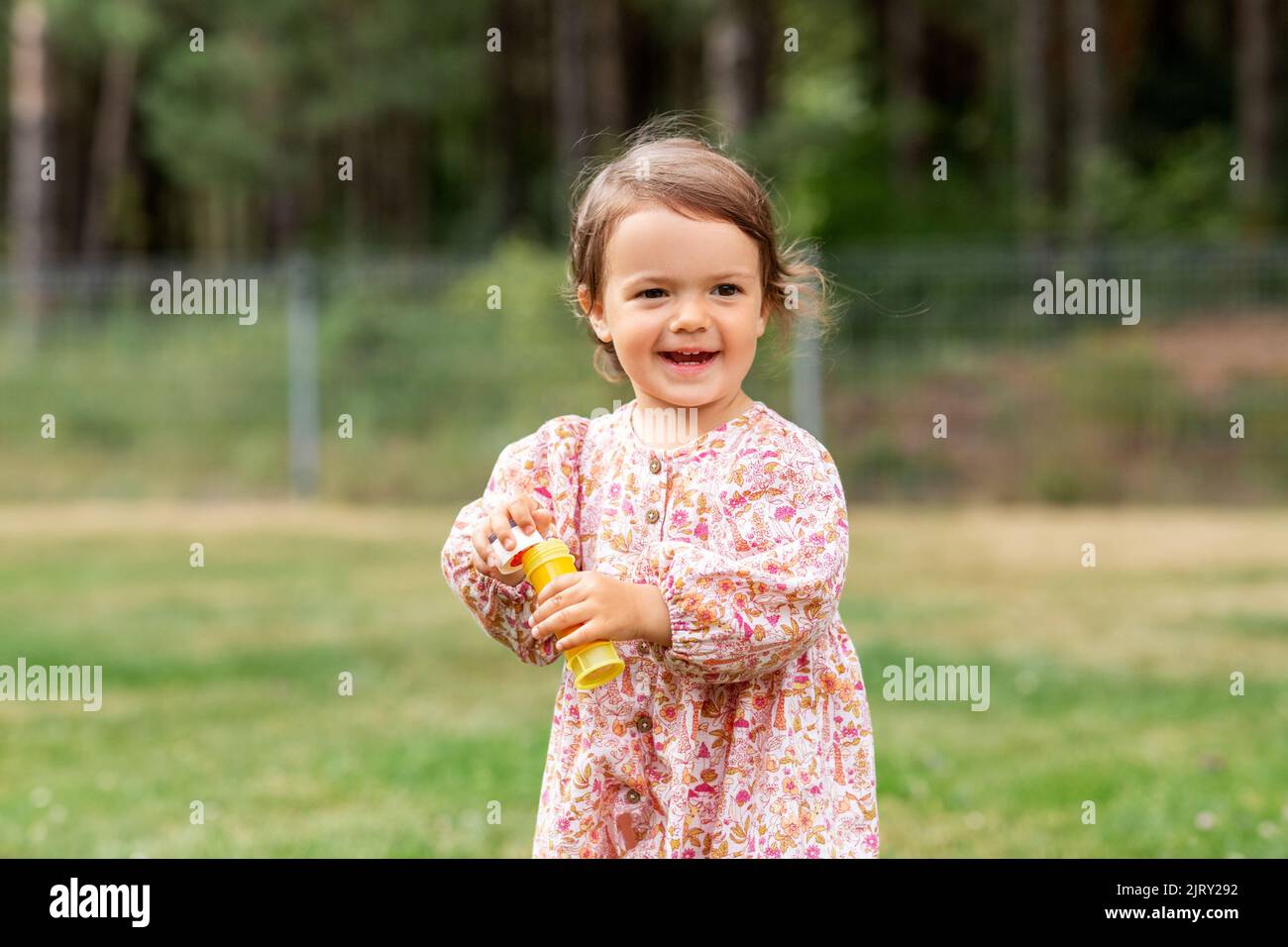 happy baby girl with soap bubble blower in summer Stock Photo - Alamy