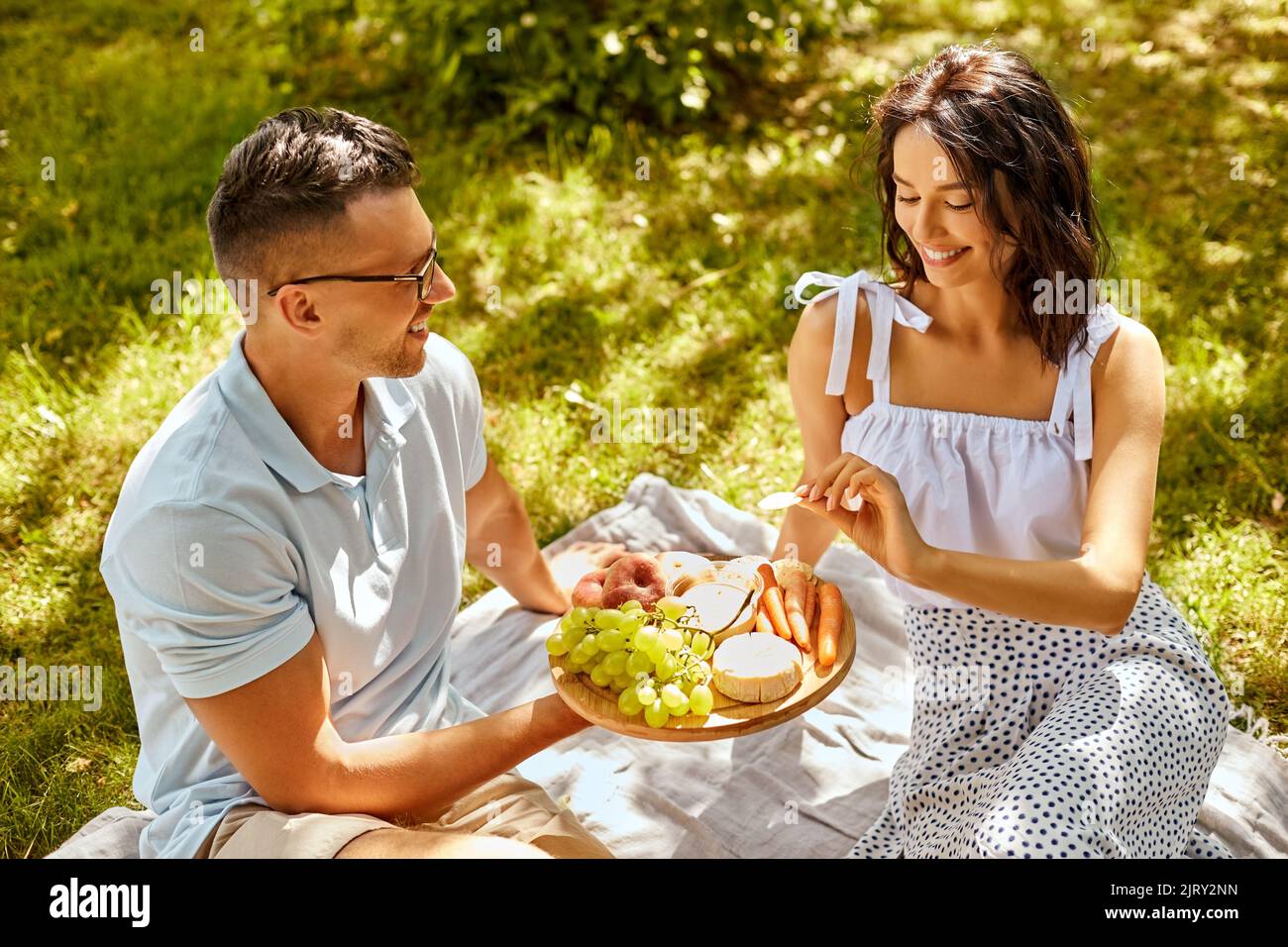 Happy man woman having picnic hi-res stock photography and images - Alamy