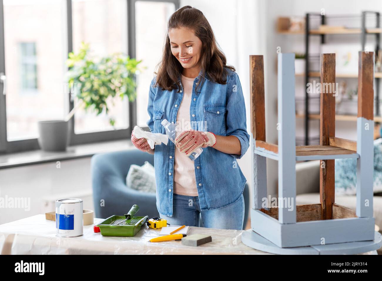 woman applying solvent to rag at home Stock Photo - Alamy