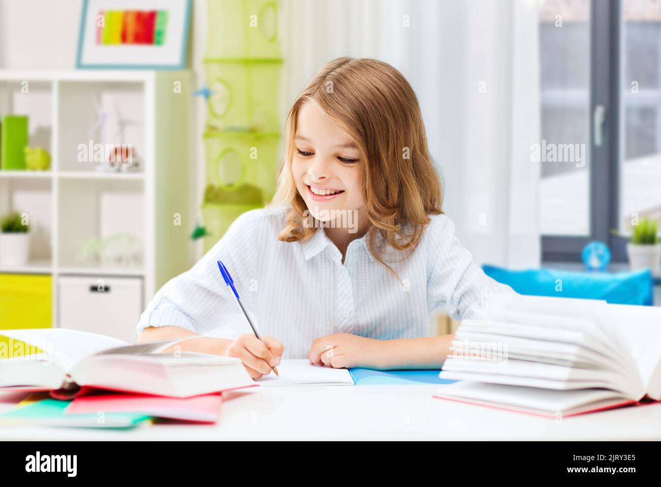 student girl with books learning at home Stock Photo - Alamy