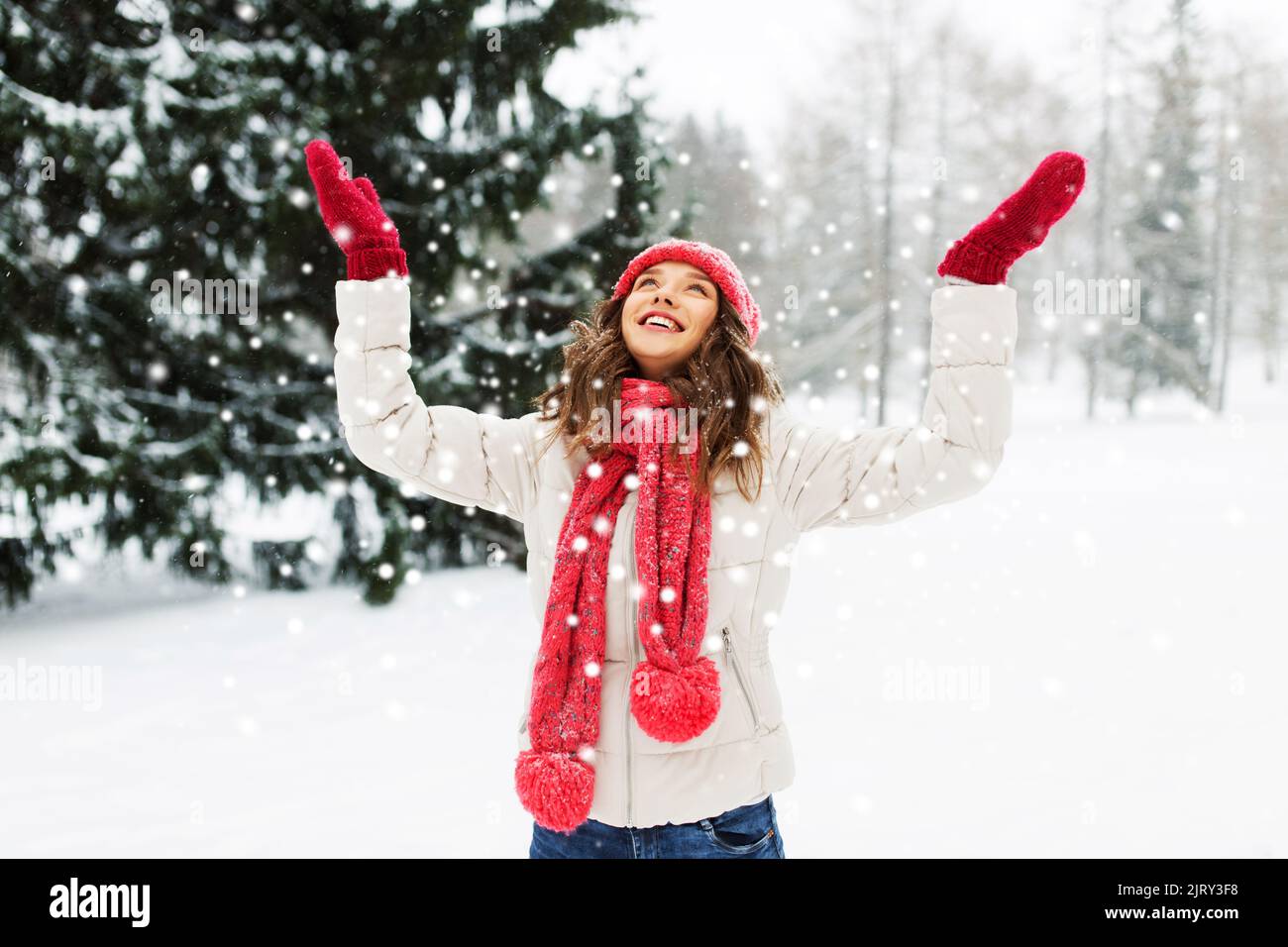 happy young woman in winter park over snow Stock Photo - Alamy