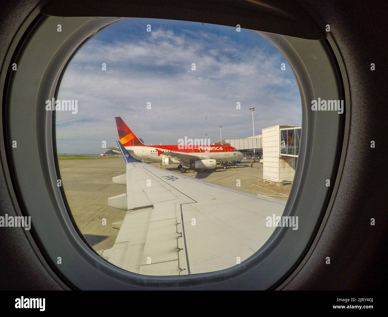 Window of an airplane at Santos Dumont Airport in Rio de Janeiro, Brazil - May 01, 2019: View from the window of an airplane preparing to maneuver at Stock Photo