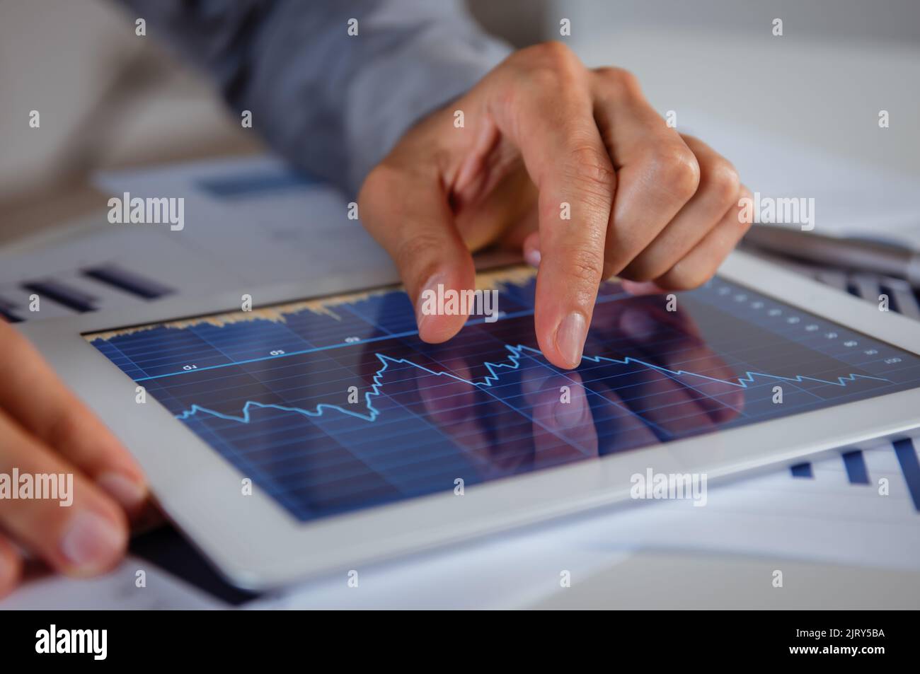 Close Up Of Businessman's Hand Analysing Graph On Digital Tablet Stock ...