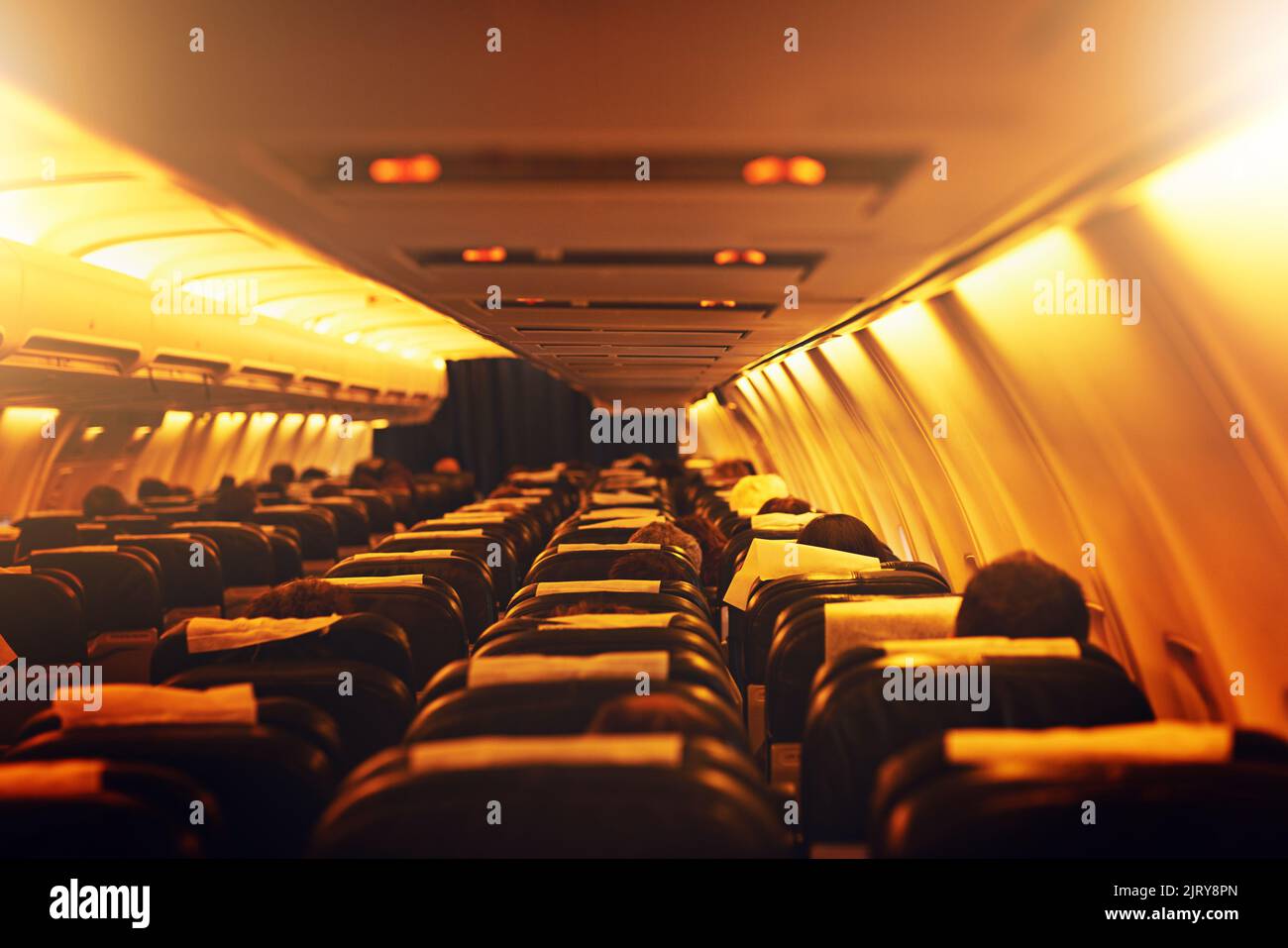 Theres a whole big world to explore out there. passenger seating inside an airplane. Stock Photo