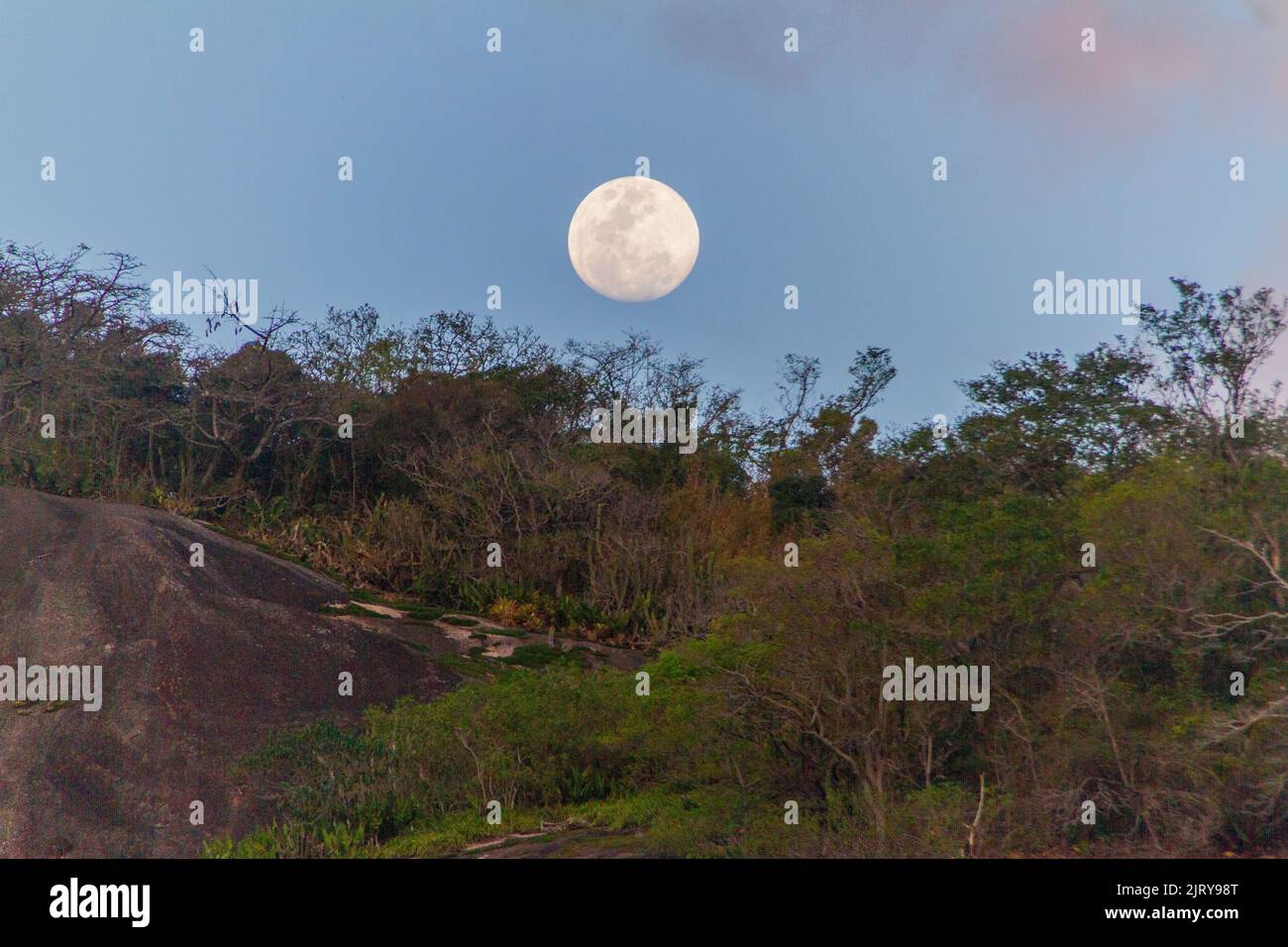 moon over the helm rock in rio de janeiro. Stock Photo