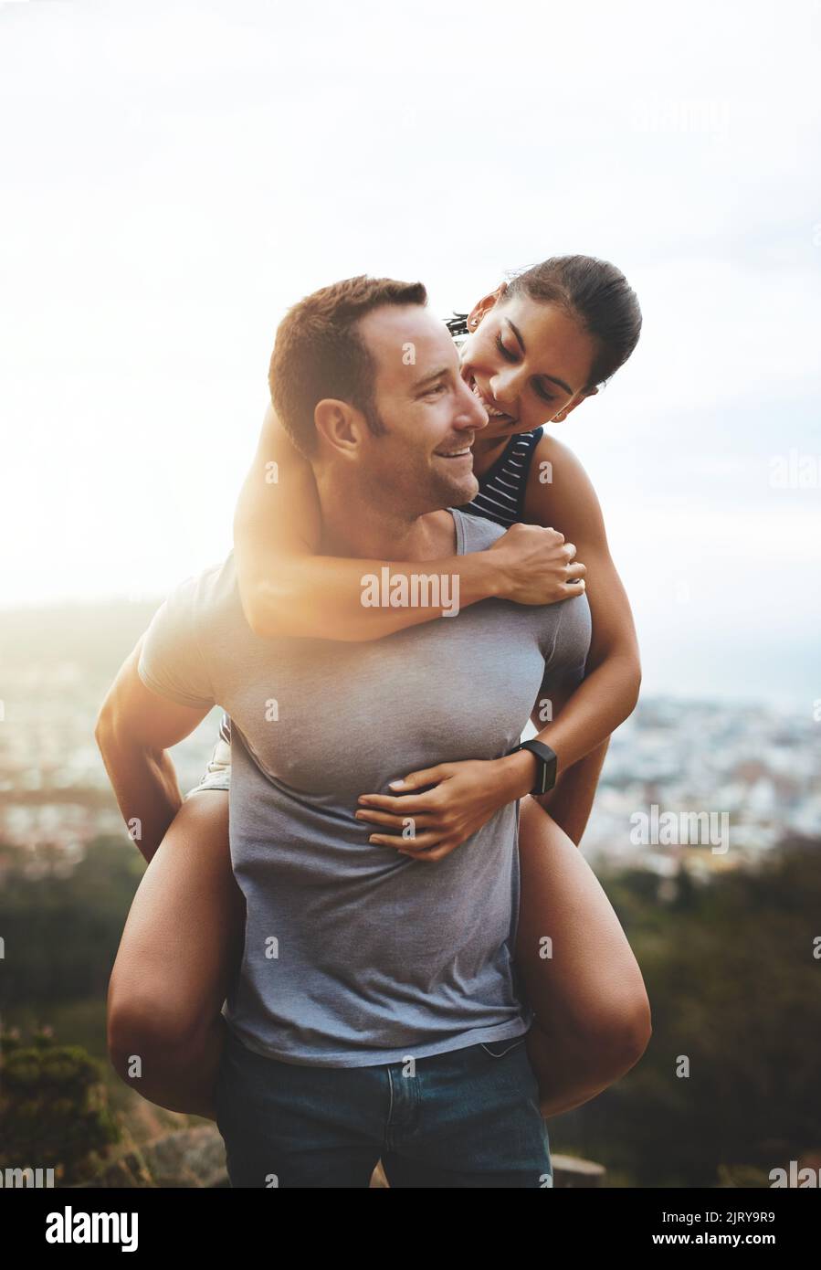 Where to next. a happy young couple enjoying a piggyback ride outdoors ...