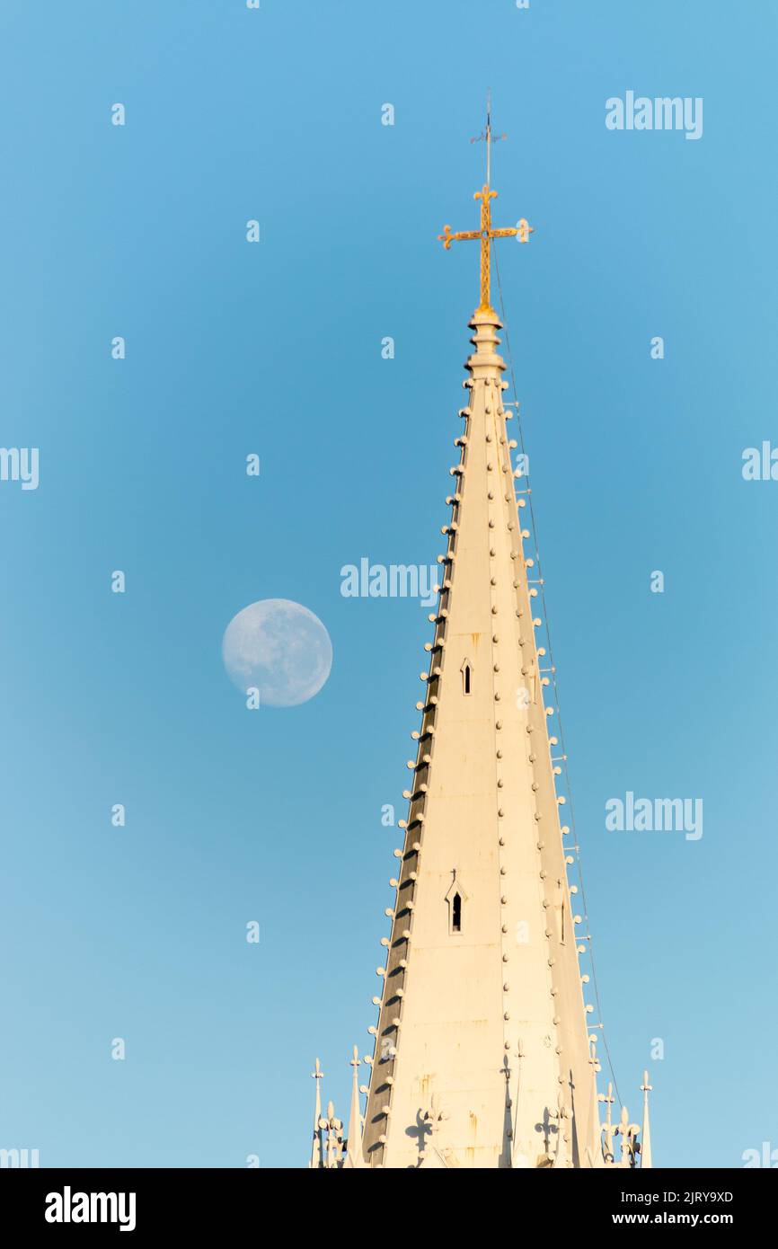 moon setting beside the tower of a church in the city of rio de janeiro brazil. Stock Photo