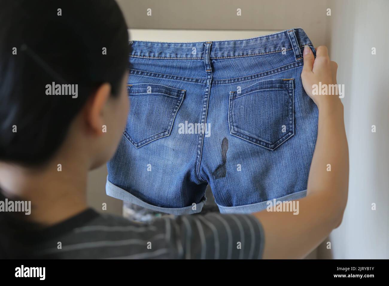 https://c8.alamy.com/comp/2JRYB1Y/women-hold-short-pants-with-period-blood-spot-stains-on-blur-background-need-to-be-cleaned-2JRYB1Y.jpg