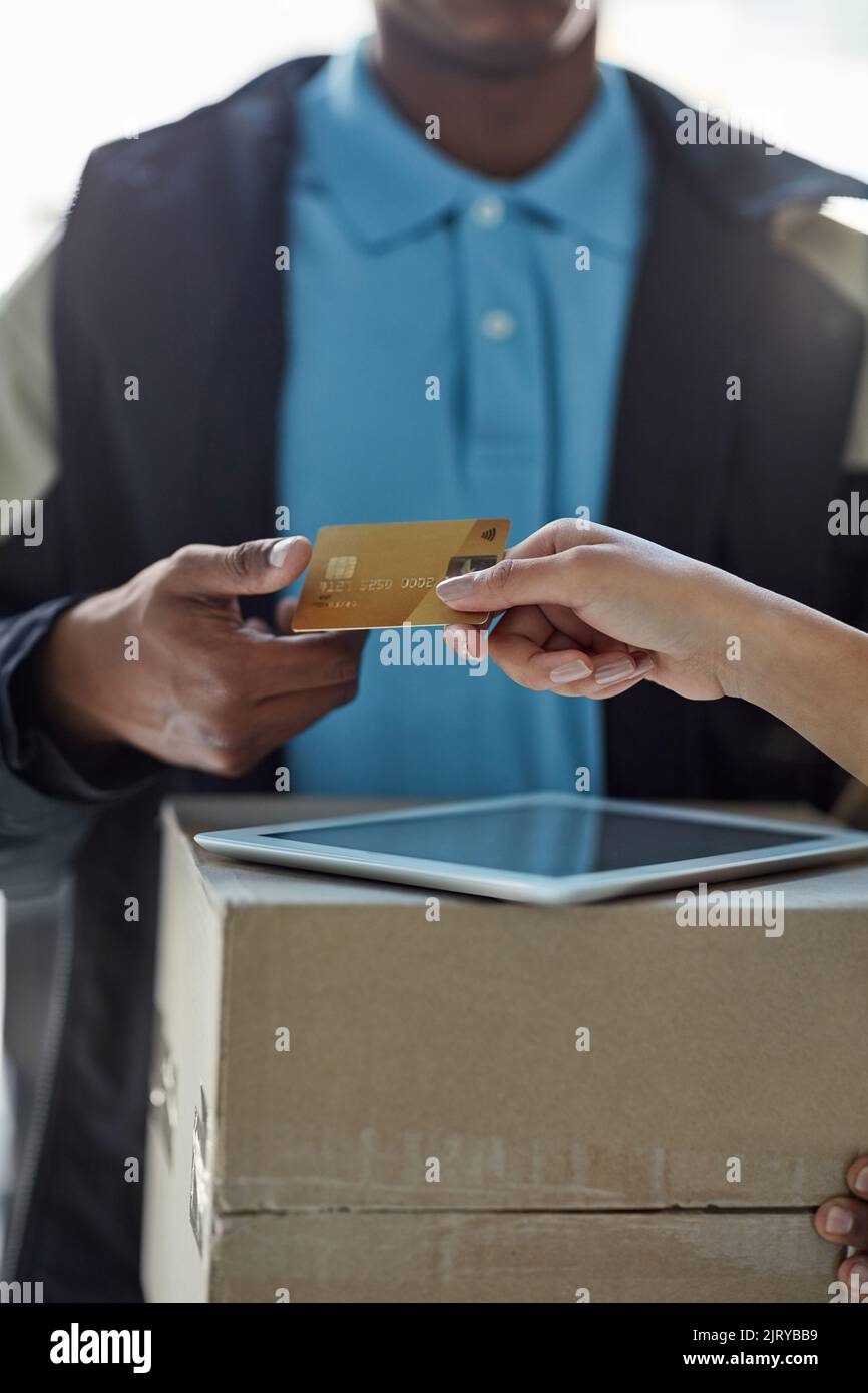 Shopping made smart. a customer using a credit card to pay for a ...