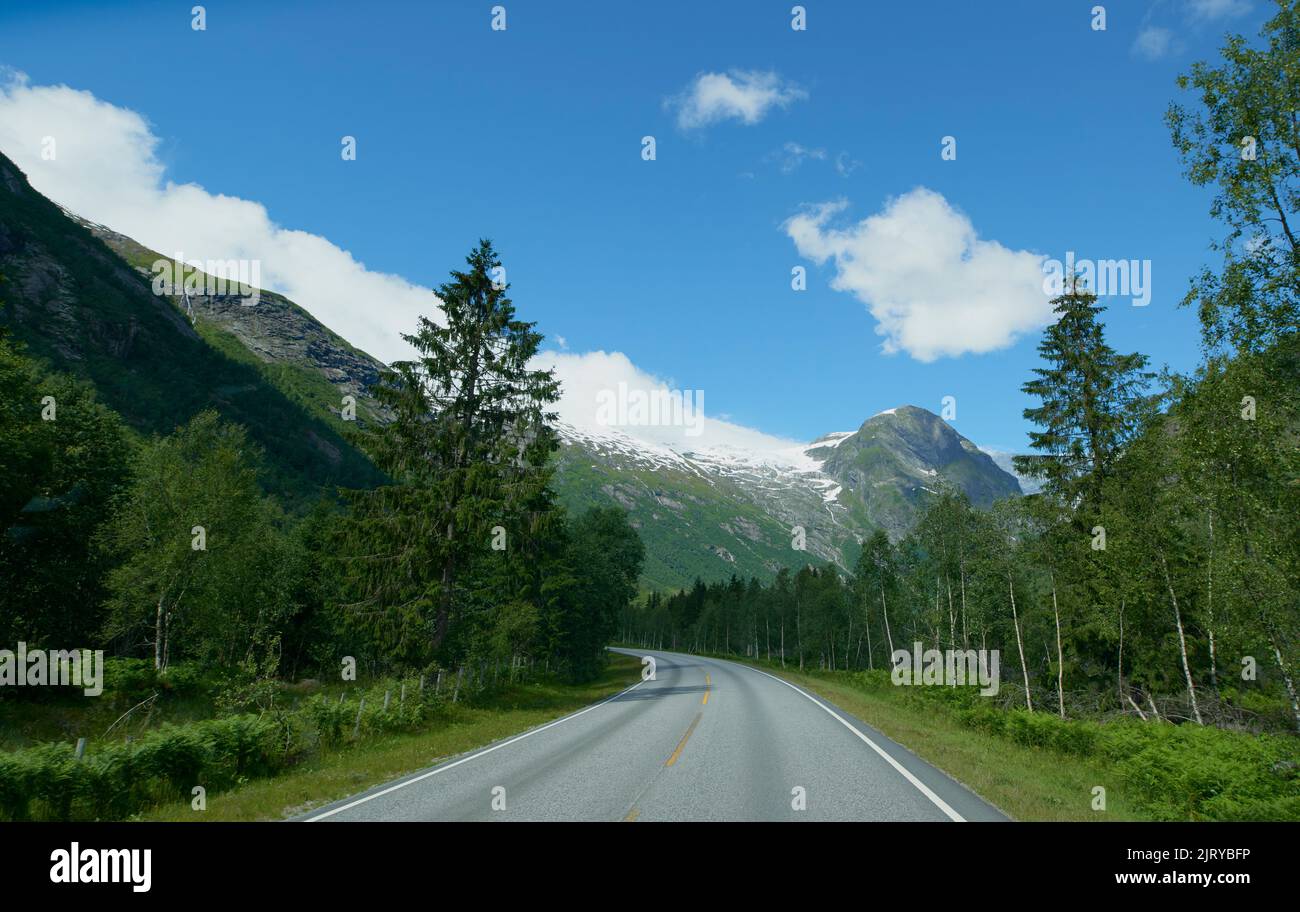 Glacier on road trip journey Majestic beautiful snow landscape exploration Stock Photo