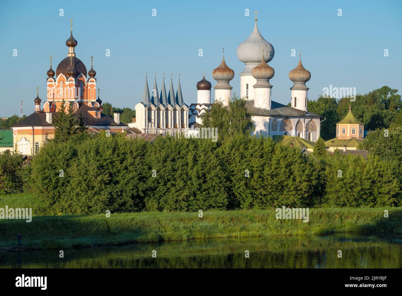 View of the temples of the ancient Tikhvin Mother of God Assumption Monastery on a sunny August morning. Leningrad region, Russia Stock Photo