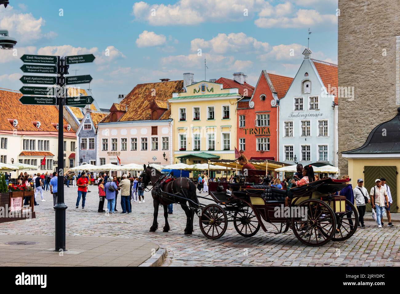 Market square with historic buildings and horse-drawn carriage, Estonian capital of Tallinn, Estonia, Baltics, Europe Stock Photo