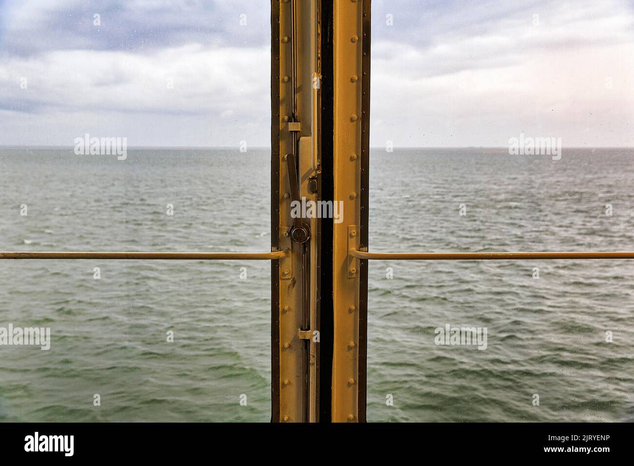 View through window, door on a ferry, dreary weather in autumn, raindrops on pane, North Sea, Schleswig-Holstein, Germany Stock Photo
