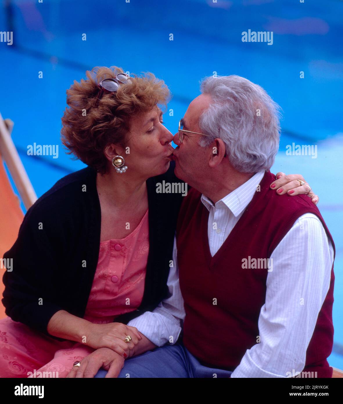 Elderly couple, kissing Stock Photo
