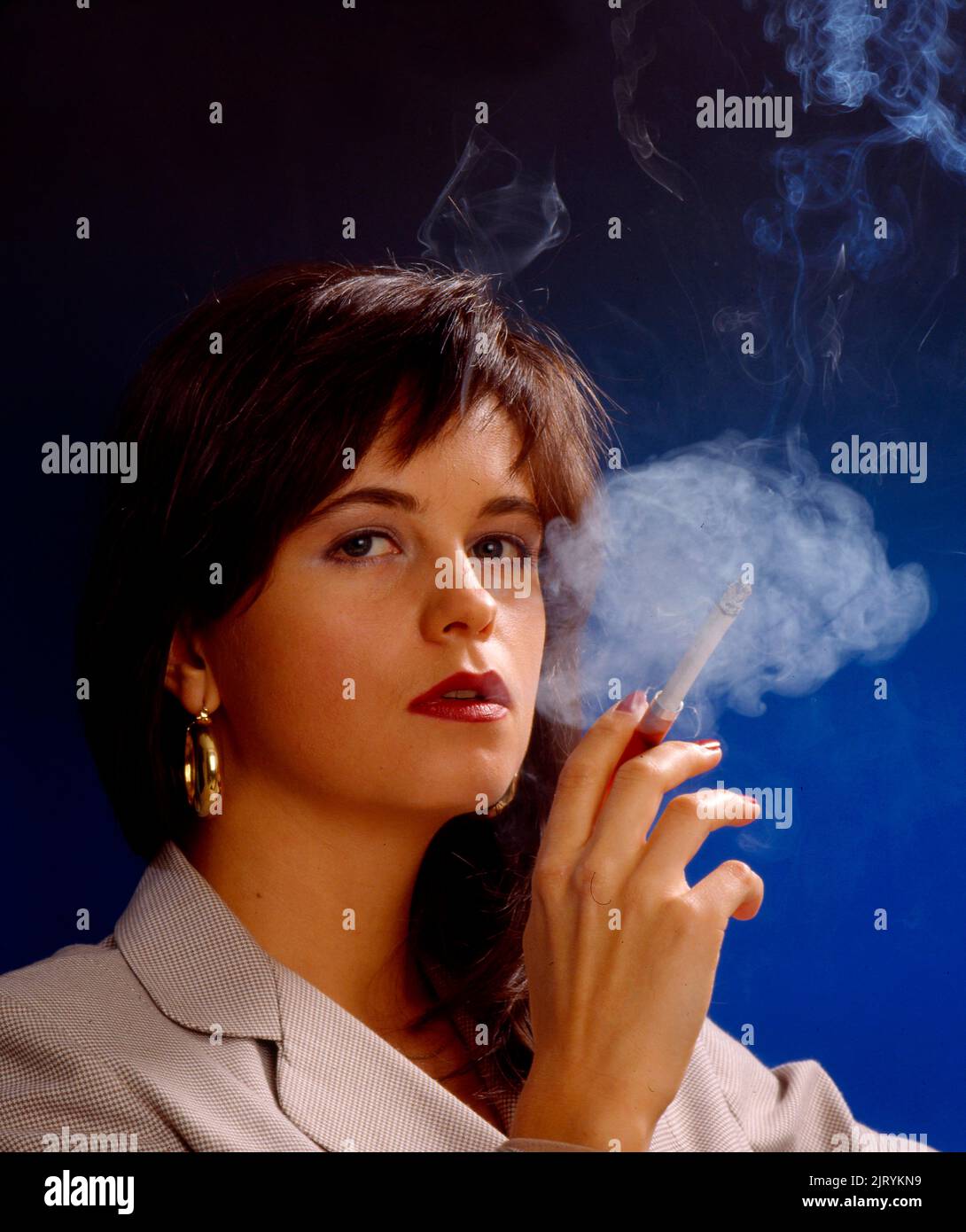 Woman Smoking Cigarette Stock Photo