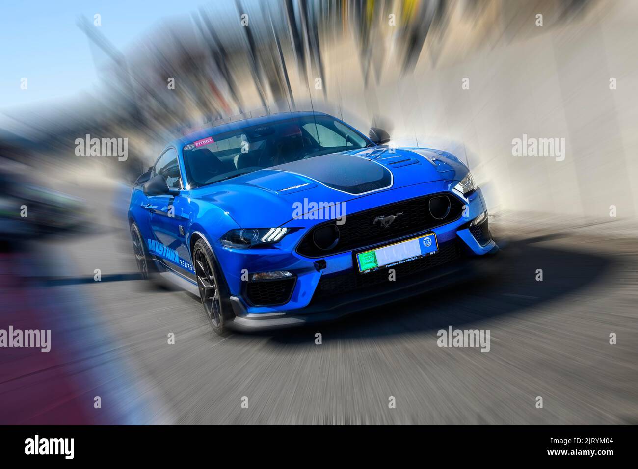 Dynamic photo with zoom effect of sports car race car Ford Mustang