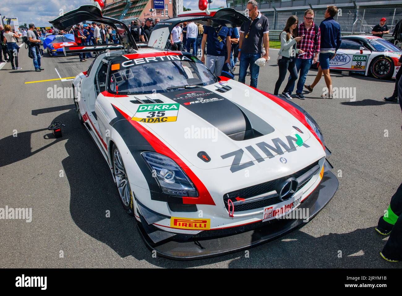 Mercedes SLS AMG GT3 with open wing doors lines up in grid lane of ADAC ...