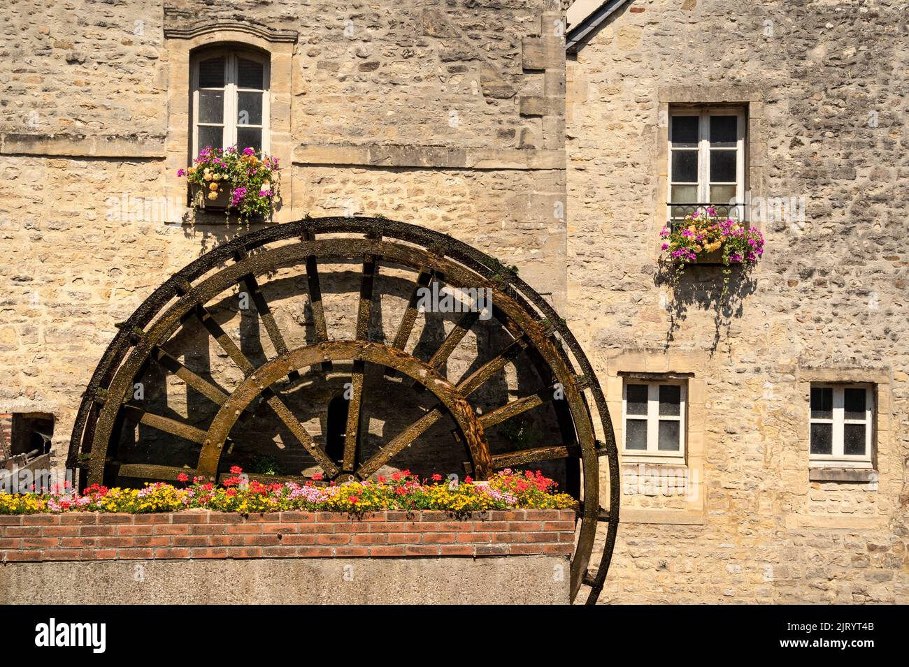 A water wheel at the Aure river of Bayeux, Frace Stock Photo