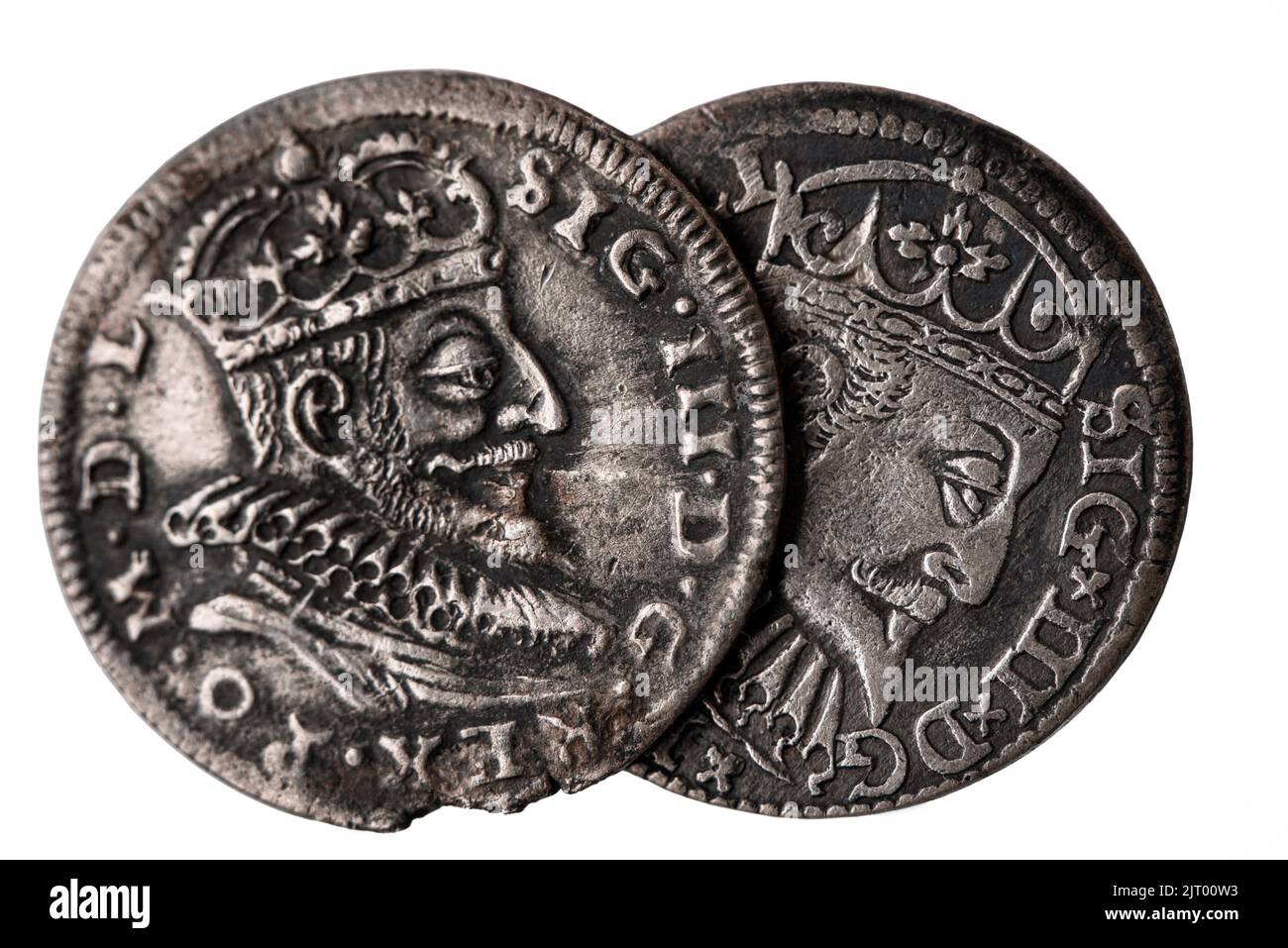 Two old silver coins 16th century isolated on white. Averse of triple groschen with portrait of Sigismund III Vasa, King of Poland Stock Photo