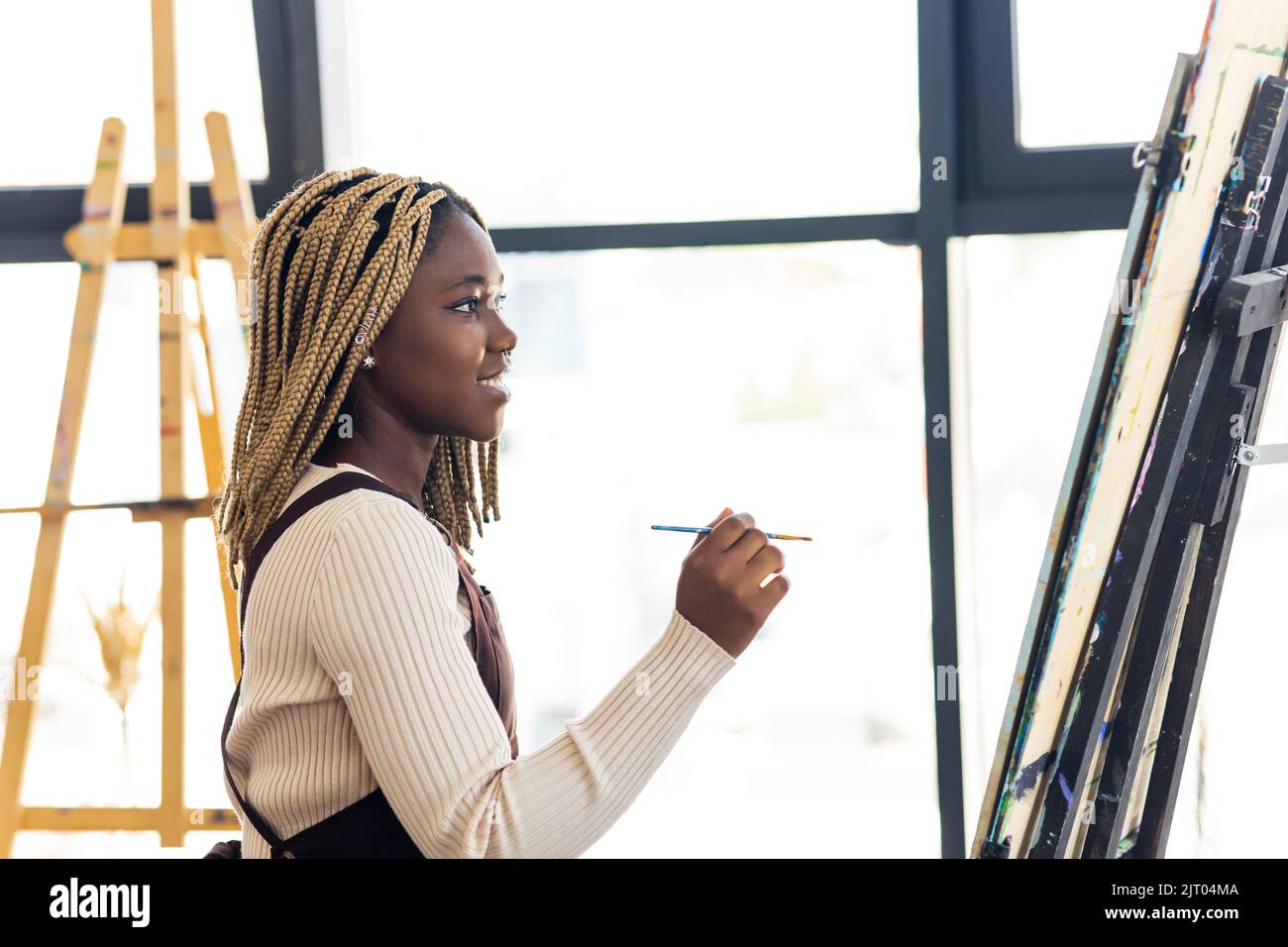 Young african student with septum nose piercing at the art studio Stock Photo