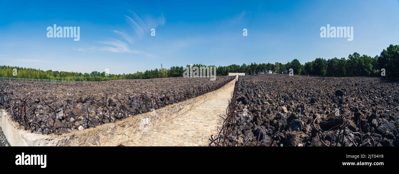 08.27.2022 - Belzec, Poland - Belzec Nazi Death Camp. Stone path running through remains of former nazi death camp. Panoramic shot of Holocaust memorial museum. High quality photo Stock Photo