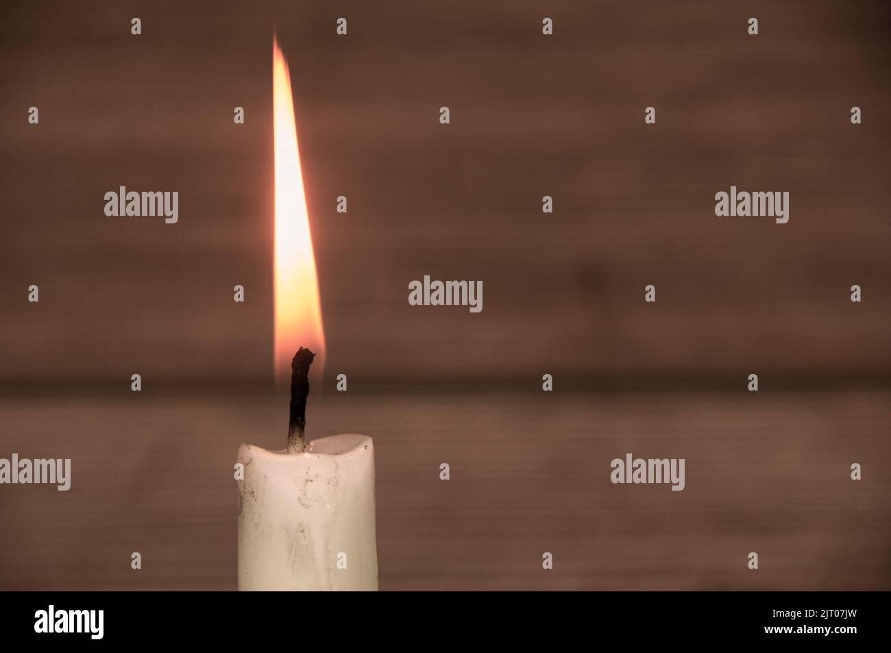 Candle light burning brightly with customizable space for text or ideas