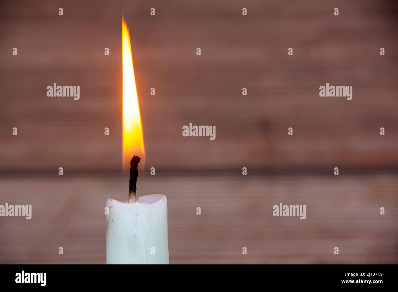 Candle light burning brightly with customizable space for text or ideas. Copy space. Stock Photo