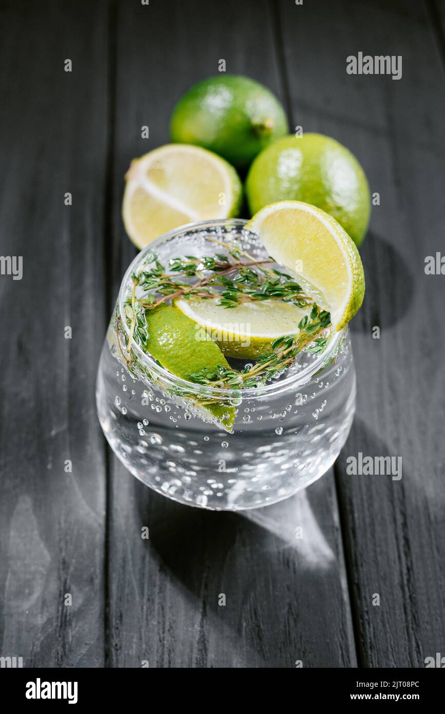 Strong seltzer cocktails with lime. Alcoholic cocktail tonic clear. hard seltzer is a low-alcohol drink consisting of alcohol, carbonated water and Stock Photo