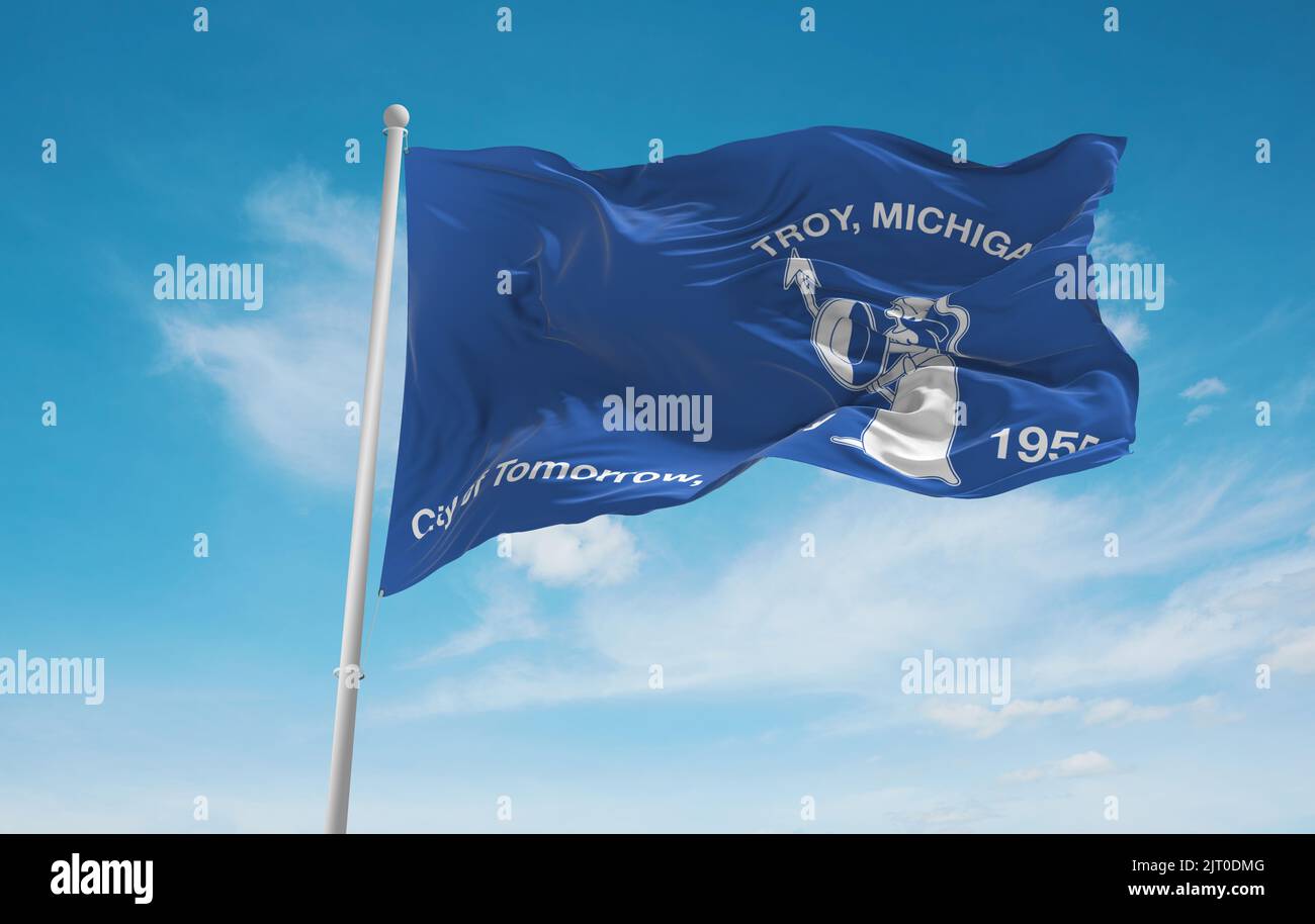 official flag of Troy, Michigan untied states of America at cloudy sky background on sunset, panoramic view. USA travel and patriot concept. copy spac Stock Photo
