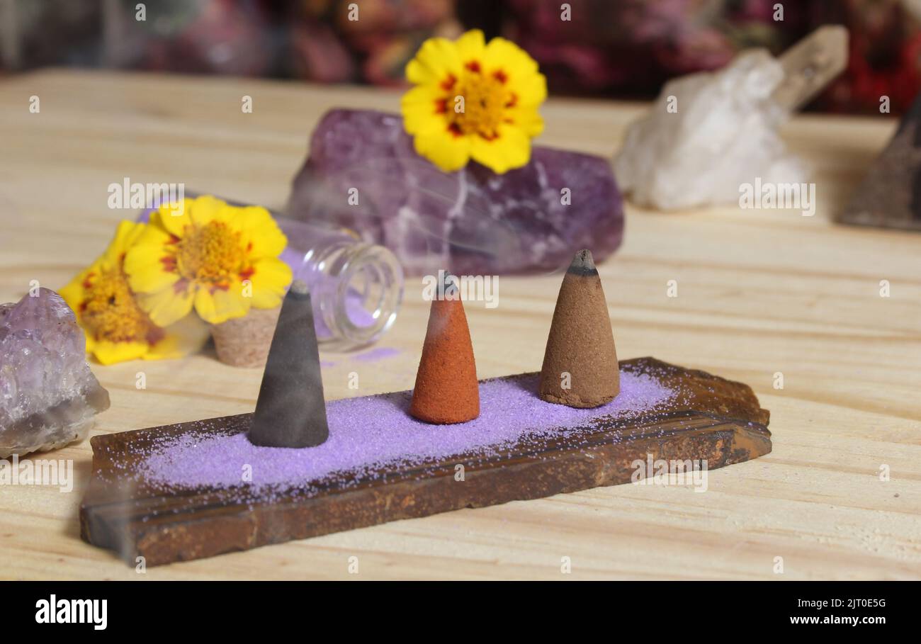 Incense Cones on Stone Slab With Rock Crystals and Flowers Stock Photo ...