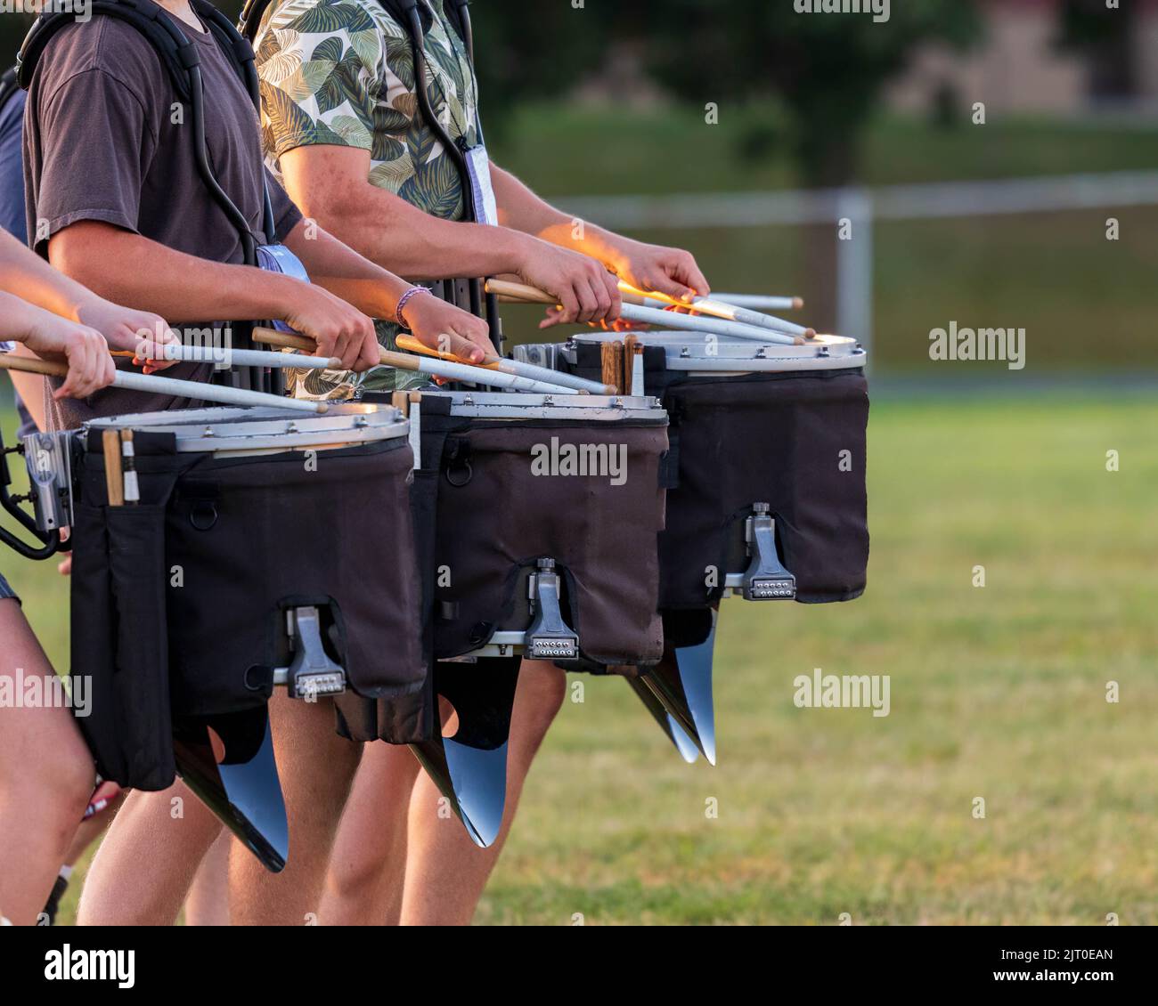 section of a marching band drum line rehearsing Stock Photo