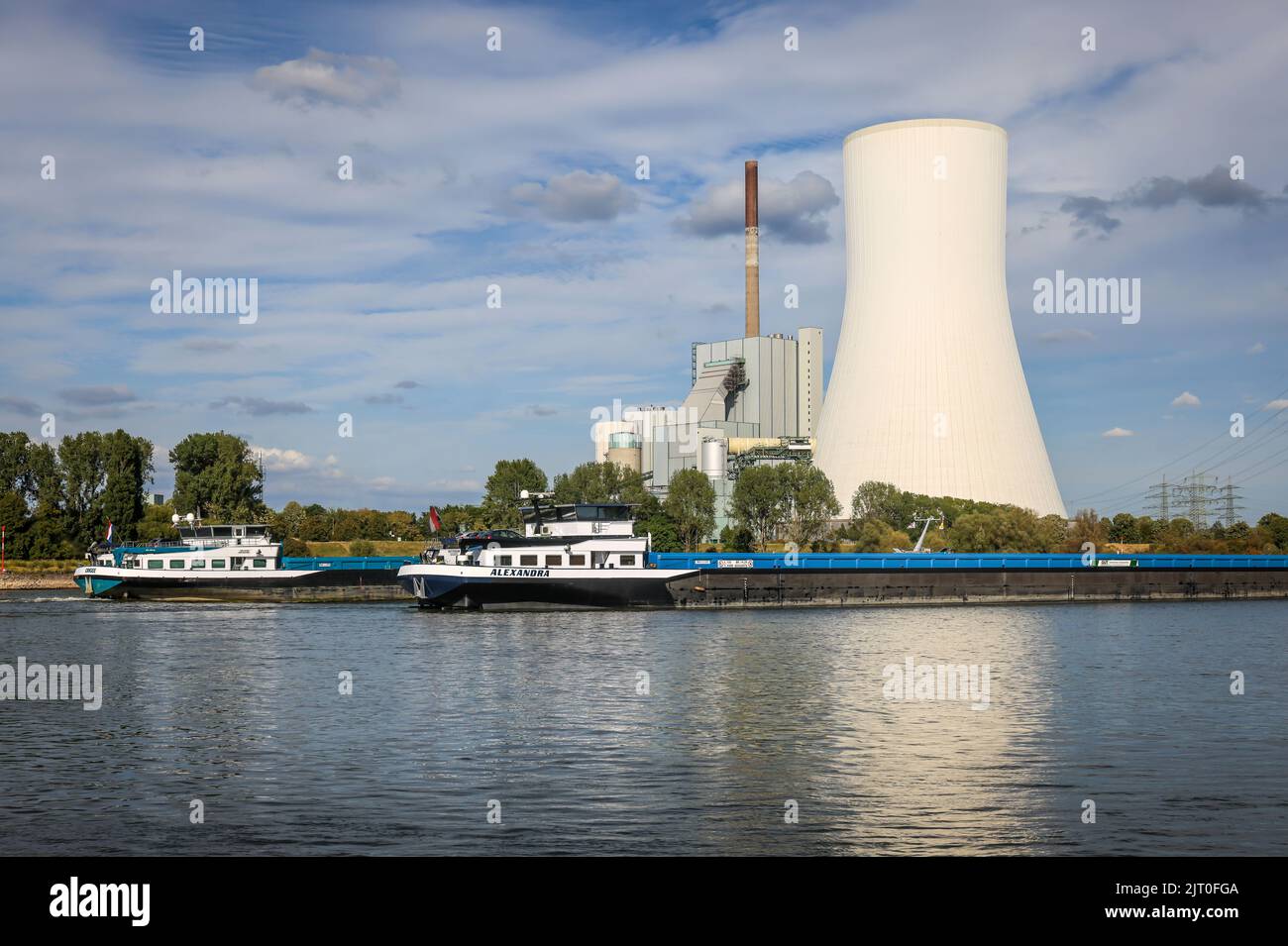 Duisburg, North Rhine-Westphalia, Germany - Low water in the Rhine with STEAG coal-fired power plant Walsum at the ferry jetty Walsum, Rhine ferry Wal Stock Photo