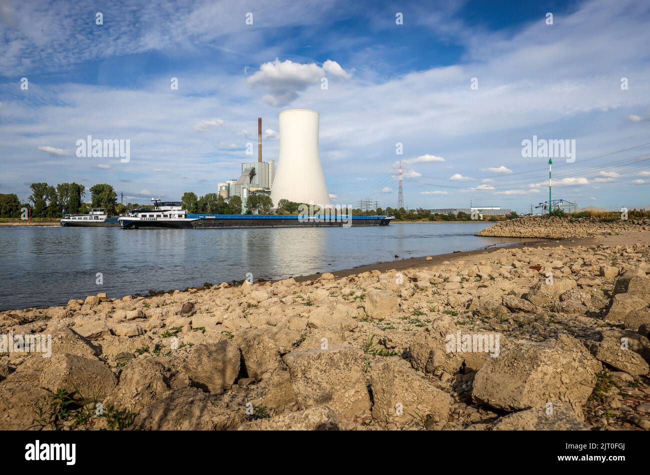 Rheinberg, Duisburg, North Rhine-Westphalia, Germany - Dry, stony riverbed in the Rhine with STEAG coal-fired power plant Walsum at the ferry pier Ors Stock Photo