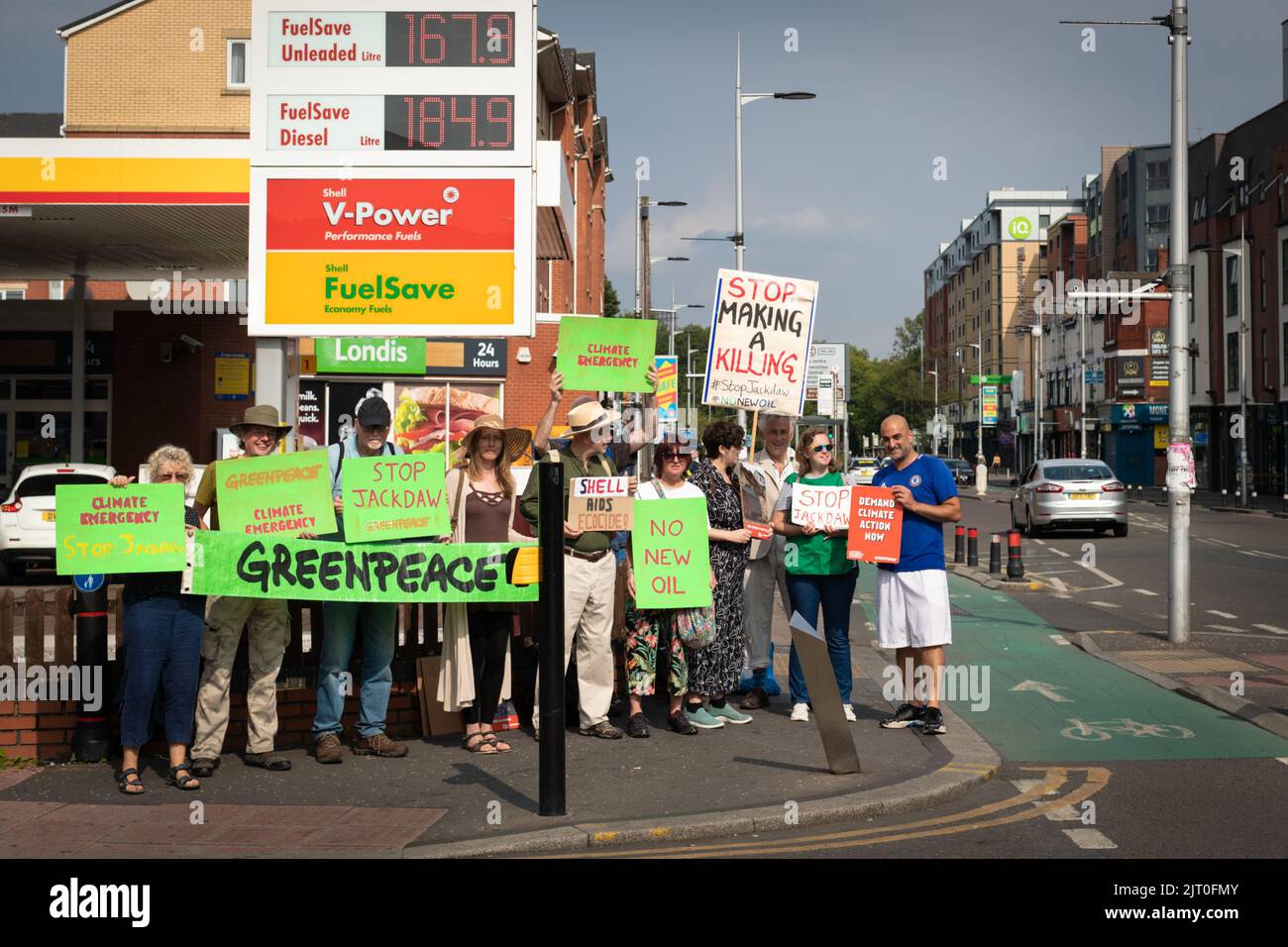 Manchester, UK. 27th Aug, 2022. Members of the environment group Greenpeace protest outside a Shell forecourt. The movement is trying to raise awareness of the proposed Jackdaw oilfield in the north sea which will only add to the climate emergency. Credit: Andy Barton/Alamy Live News Stock Photo