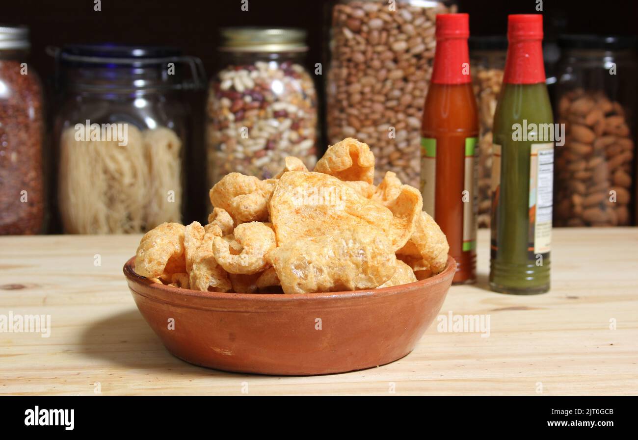 Fried Pork Skins With Hot Sauce in Rustic Kitchen Stock Photo Alamy