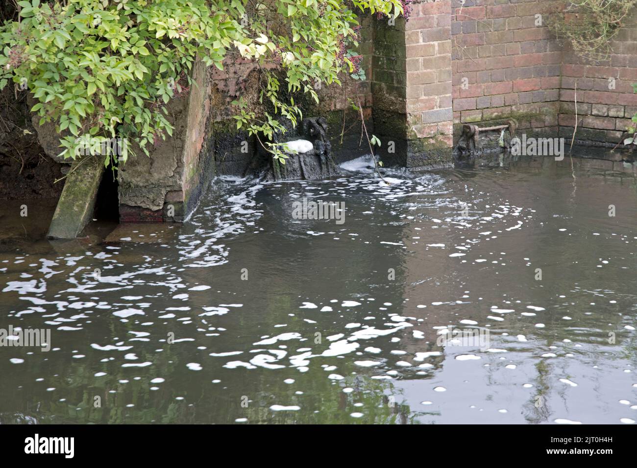 Storm drain releasing River Avon  near Welford UK Stock Photo