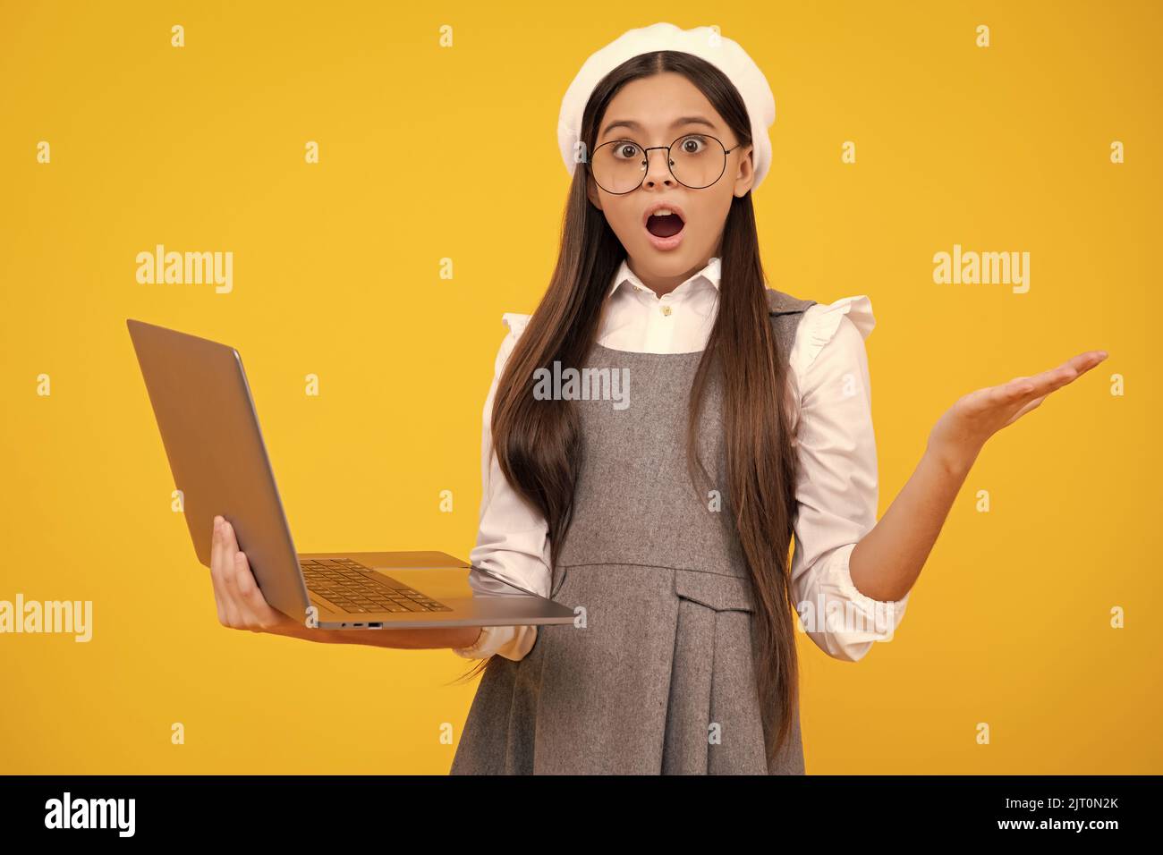 Young student school girl, studying with laptop computer. E-learning ...