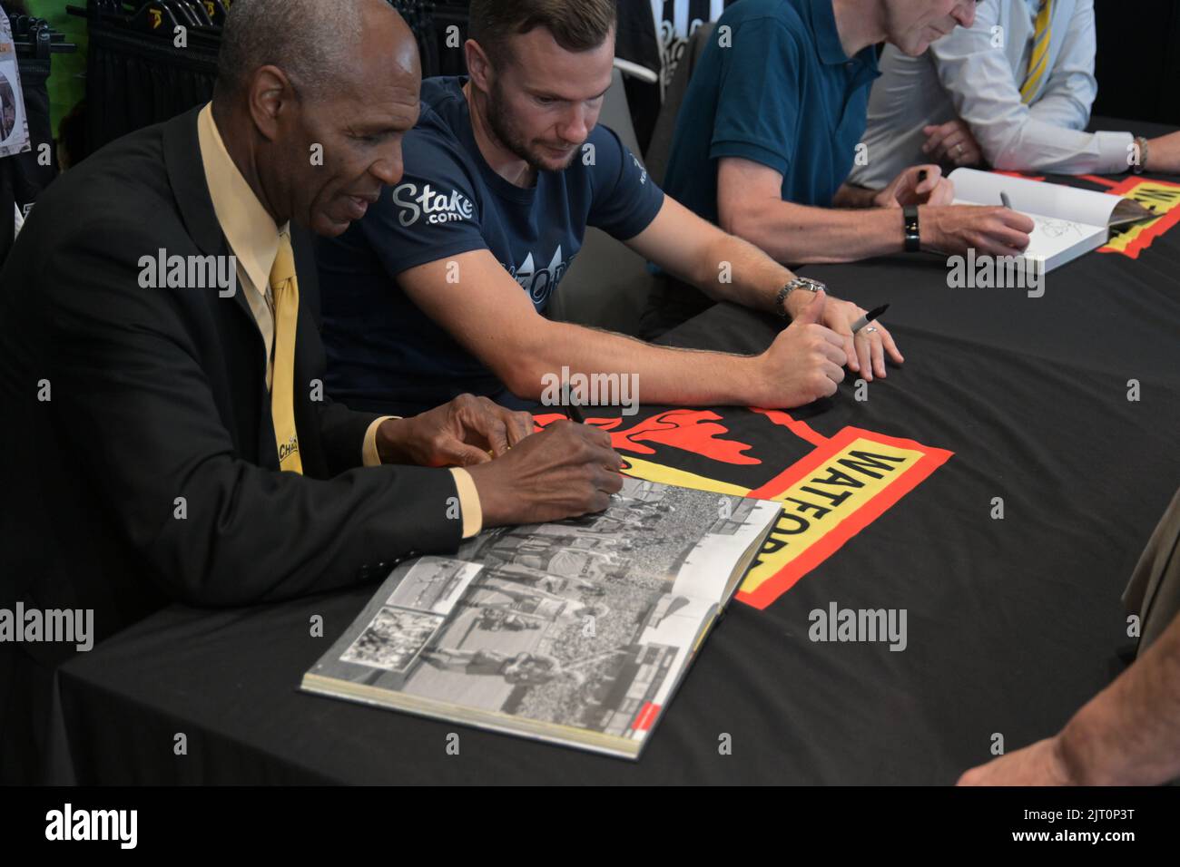 Luther Blissett  signs the new book about 100 years of Watford FC's 100 years at Vicarage Road Stock Photo