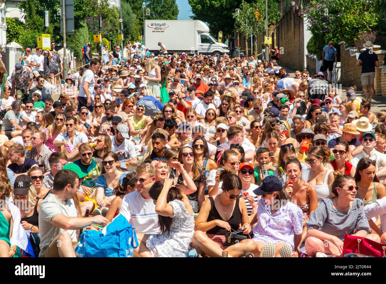 Crowds watch the Wimbledion Tennis final outside on a big screen in Northcote Road, London Stock Photo