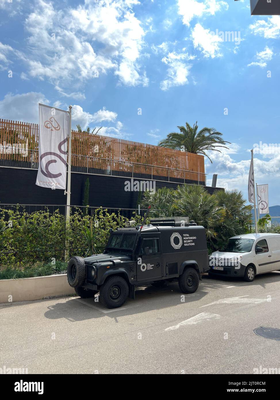 Budva, Montenegro 27.08.22 Cars stand on the side of the building