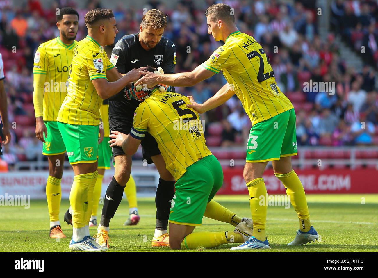 Norwich City players congratulate Norwich City's Grant Hanley following a block from him during the Sky Bet Championship match between Sunderland and Norwich City at the Stadium Of Light, Sunderland on Saturday 27th August 2022. (Credit: Michael Driver | MI News) Credit: MI News & Sport /Alamy Live News Stock Photo
